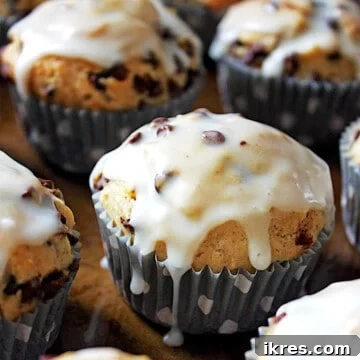 Banana walnut chocolate chip muffins covered in glaze.