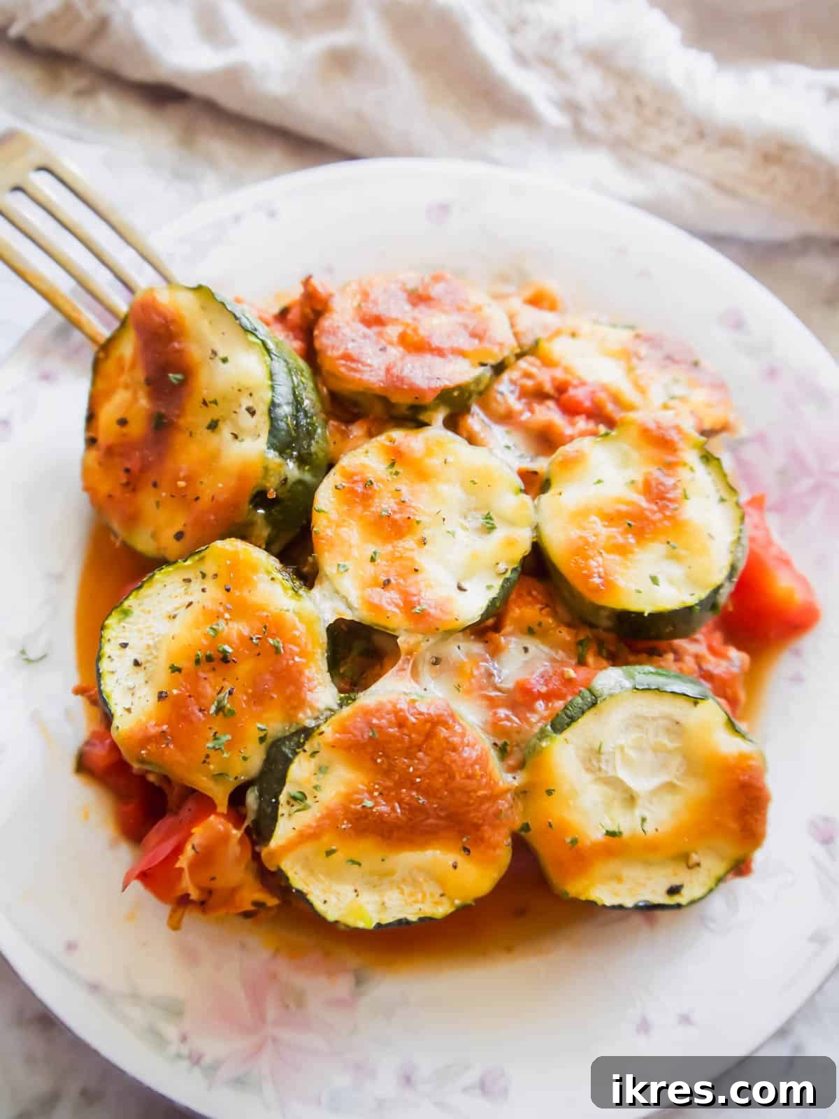 Hearty Turkey and Summer Vegetable Bake 10 A delicious slice of noodle-free lasagna casserole, showcasing its vibrant layers of vegetables and meat sauce.