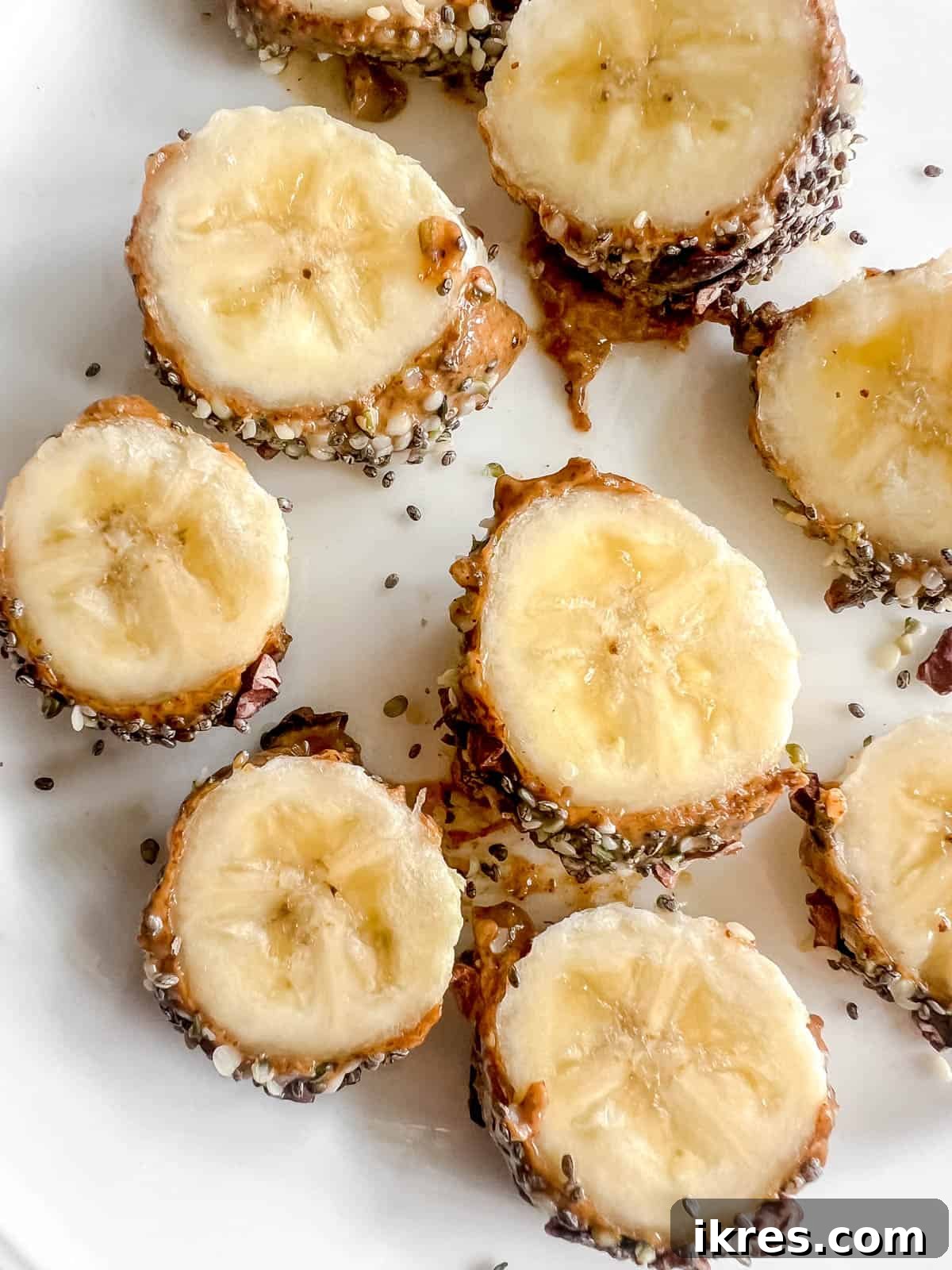 Banana Breakfast Pinwheels 7 A close-up of several banana sushi slices artfully arranged on a plate, highlighting the delicious toppings.