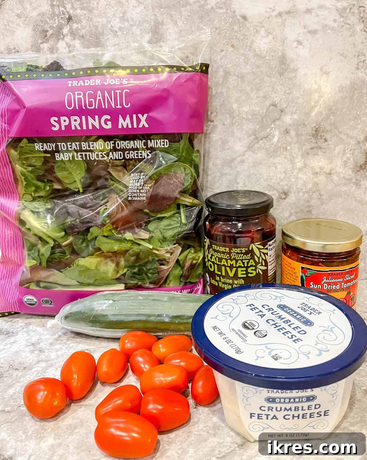 Vibrant Grilled Chicken Greek Salad 4 Raw chicken breast pieces and fresh lemon, prepared for marinating and grilling to perfection.