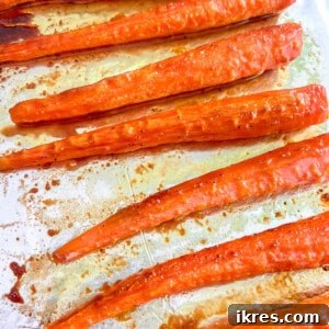 Turmeric maple glazed carrots fresh out of the oven, square format.