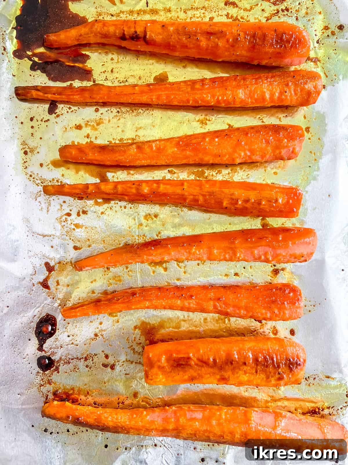 Sunshine Maple Glazed Carrots 6 Oven-roasted maple syrup glazed carrots, golden-brown and tender, after cooking.