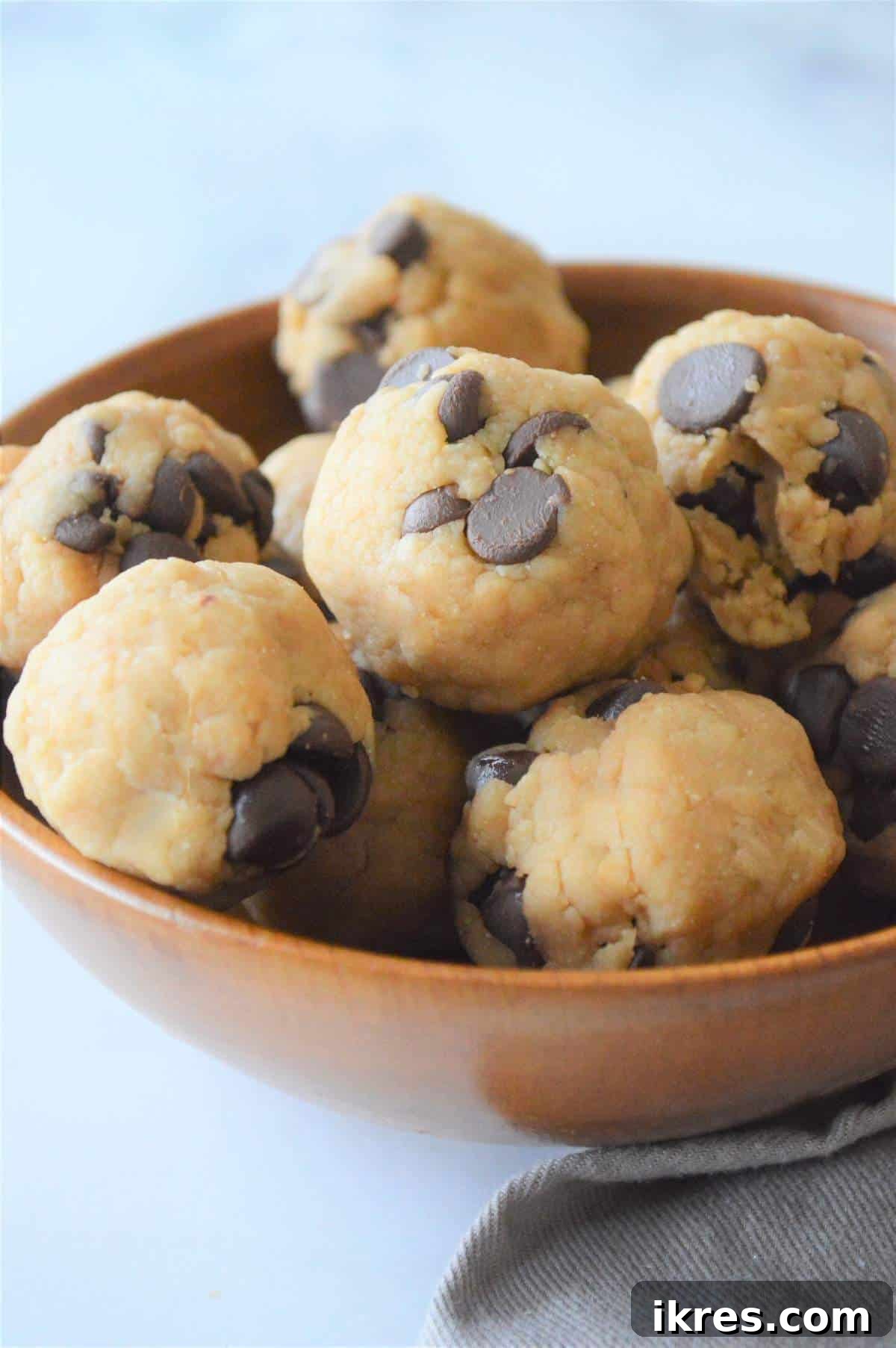 Easy No-Bake Power Bites 9 A full bowl of finished no-bake cookie dough energy bites, ready to be enjoyed.