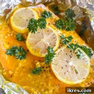 Baked lemon ginger turmeric salmon in foil, close up