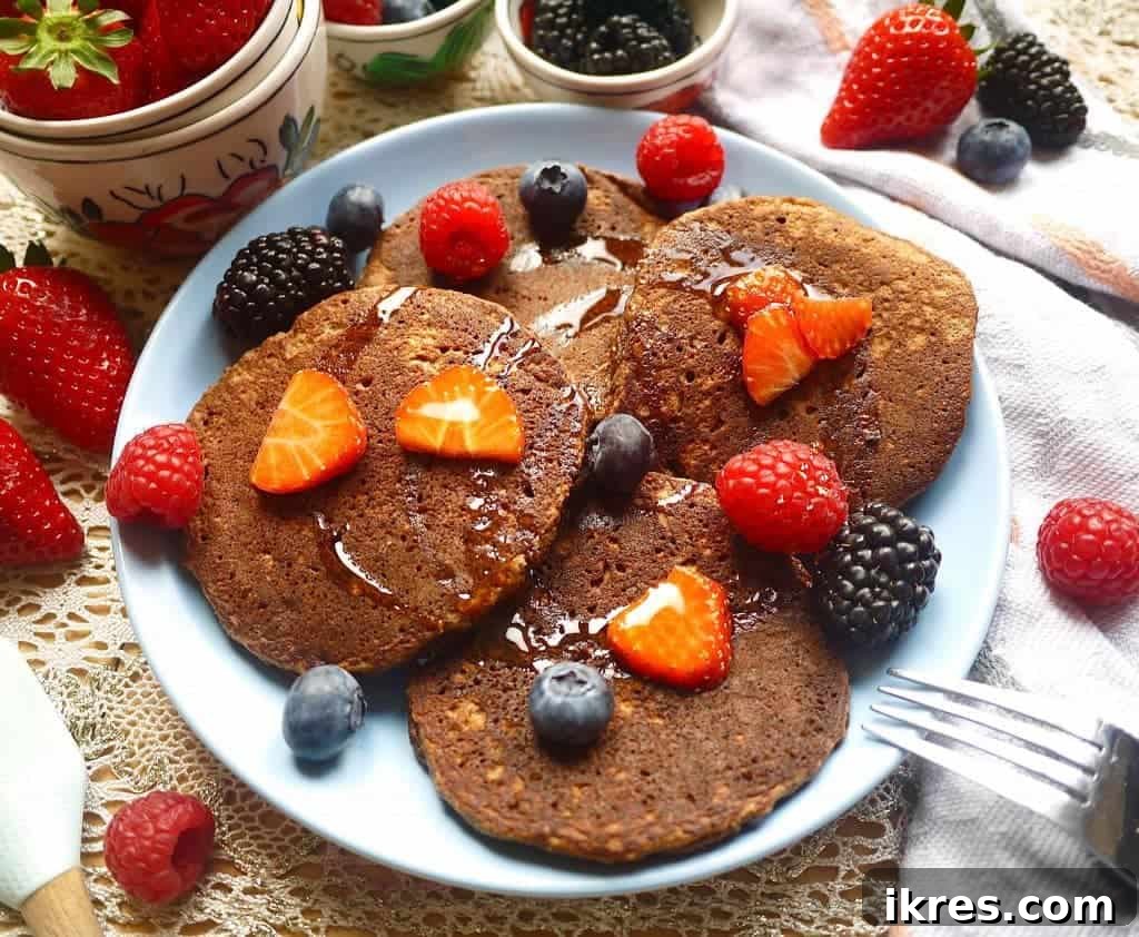 Delicious and healthy Chocolatey Cocoa Paleo Pancakes (GF) are perfect for a weekend brunch. | Perchance to Cook, www.perchancetocook.com