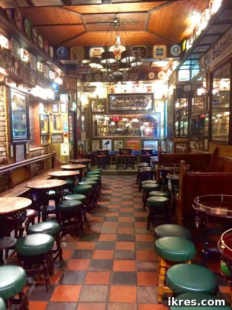 The antique-filled interior of Duke of York, showcasing Guinness memorabilia and classic pub decor.