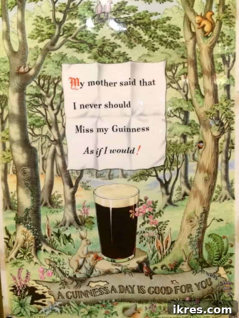 A close-up of a perfectly poured pint of Guinness, a must-try in an Irish pub.