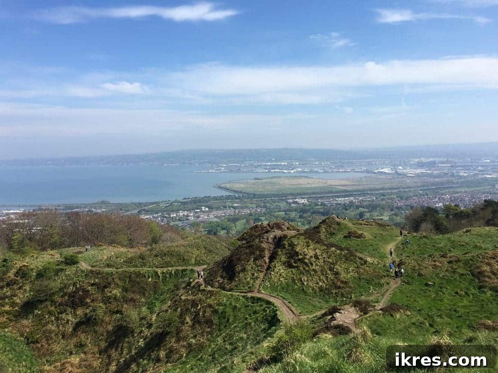 A triumphant view from the summit of Cave Hill, offering expansive vistas of Belfast and its surroundings.