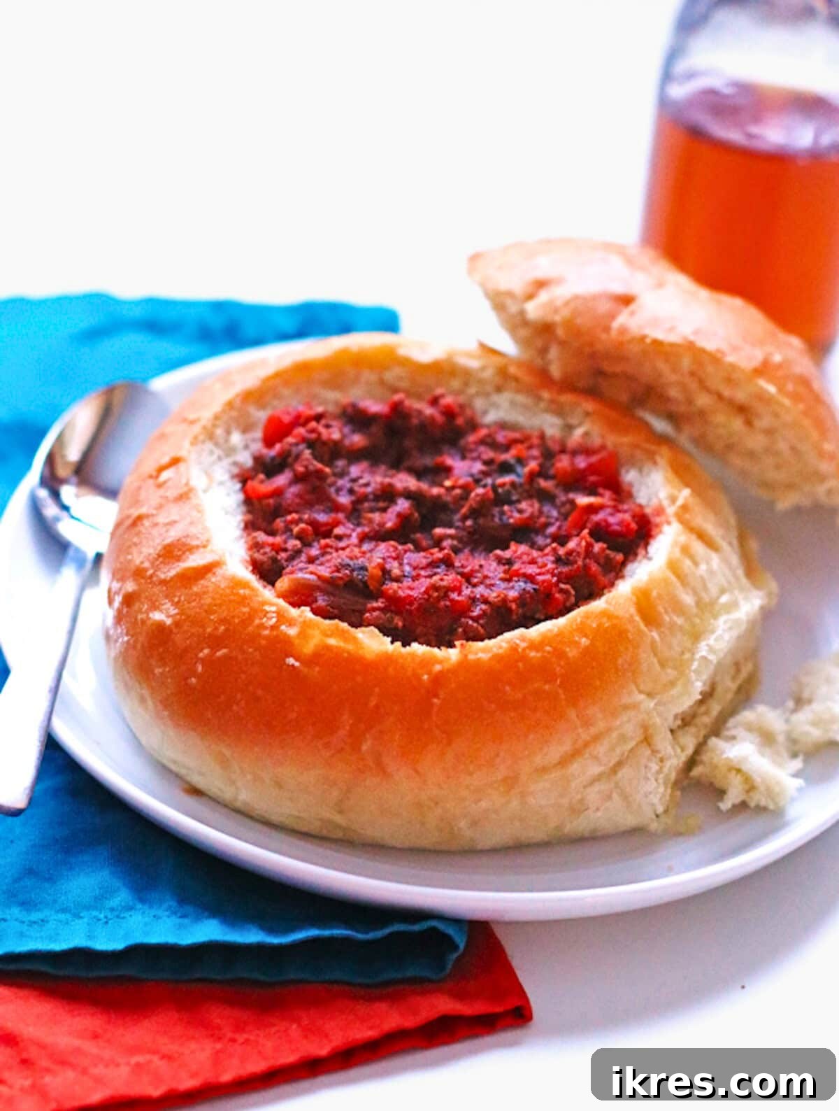 Homemade bread bowls filled with delicious chili and topped with cheese.