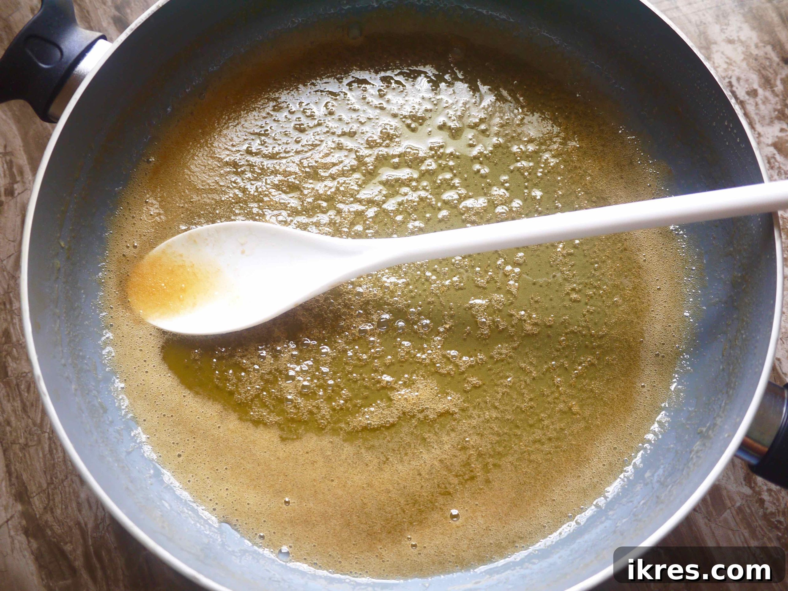 Paleo Honey Candied Orange Peels 6 Honey and water in a pan.