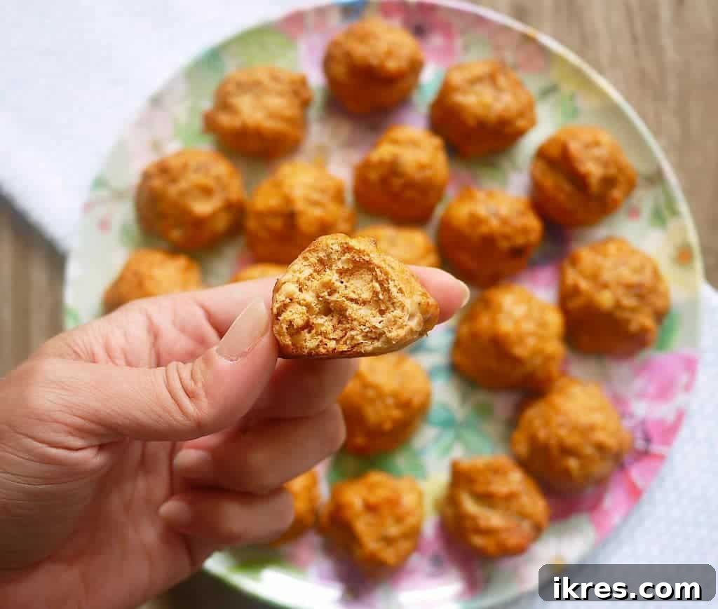 Close-up of golden-brown chicken taco meatballs, highlighting their delicious texture.