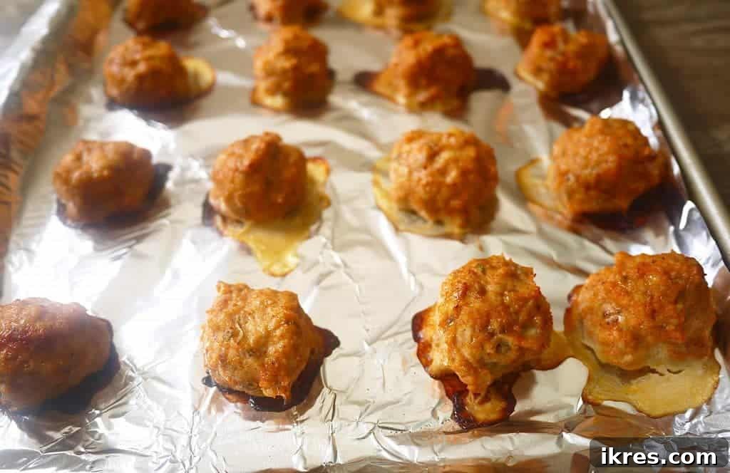 Serving of Paleo Chicken Taco Meatballs garnished with fresh cilantro and lime.