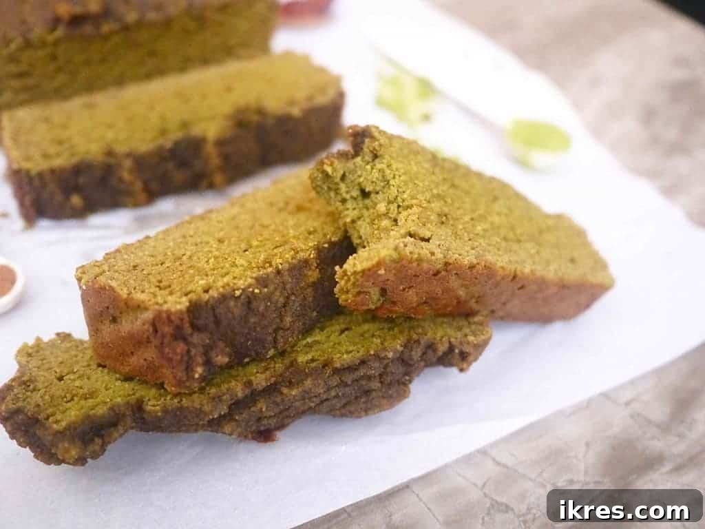 Energizing Paleo Matcha Loaf 4 Grain-Free Morning Matcha Loaf (Paleo, GF) - slice of loaf with matcha tea.