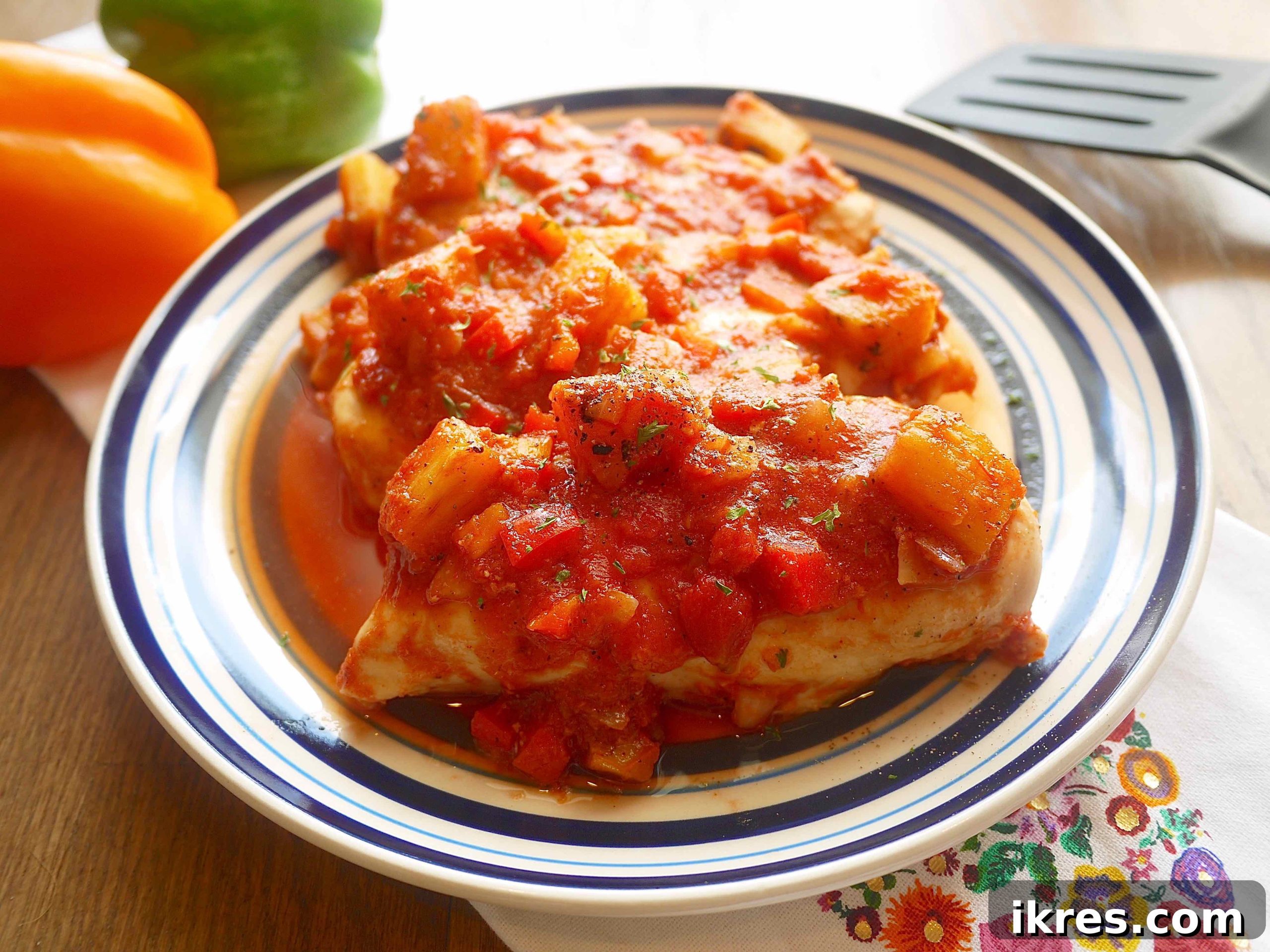 Sunshine & Smoke Salsa 6 A perfectly cooked grilled chicken breast generously topped with vibrant grilled pineapple salsa, showcasing a delicious and healthy meal idea.