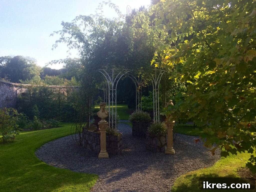 Southeast Ireland's Treasures: Kilkenny, Cashel, Durrow, and Wedding Memories 39 Elegant archway entrance to Castle Durrow, adorned with greenery