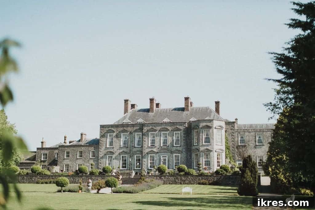 Southeast Ireland's Treasures: Kilkenny, Cashel, Durrow, and Wedding Memories 43 Bride and groom walking through the magical gardens of Castle Durrow