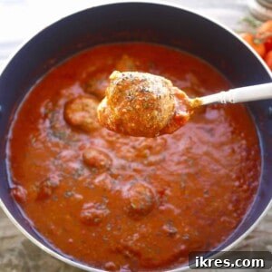 Wholesome Almond Flour Meatballs with Savory Sauce 10 Almond flour meatballs in a large pot, ready to be served.