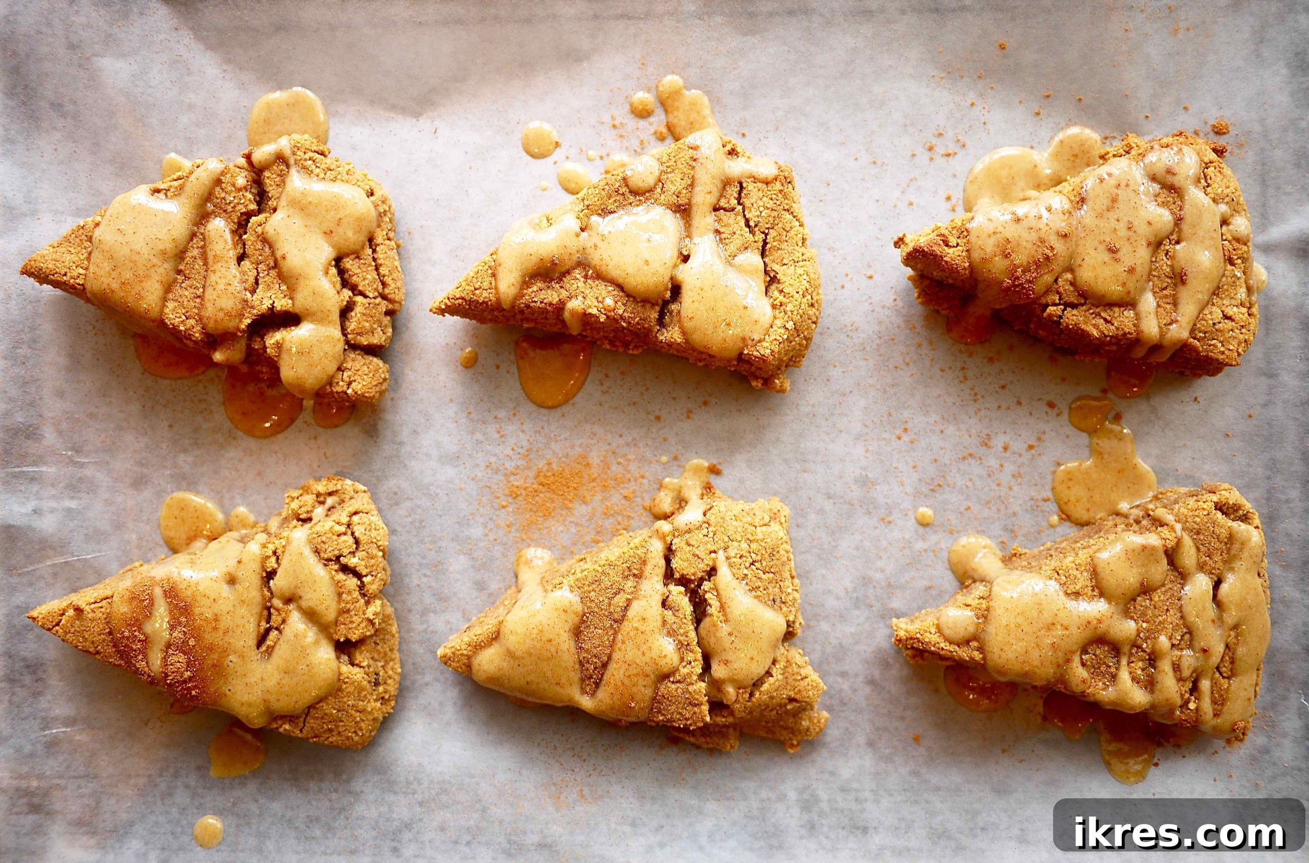 Gluten-Free Paleo Pumpkin Scones 3 Healthy pumpkin scones arranged neatly on a cookie sheet before baking.