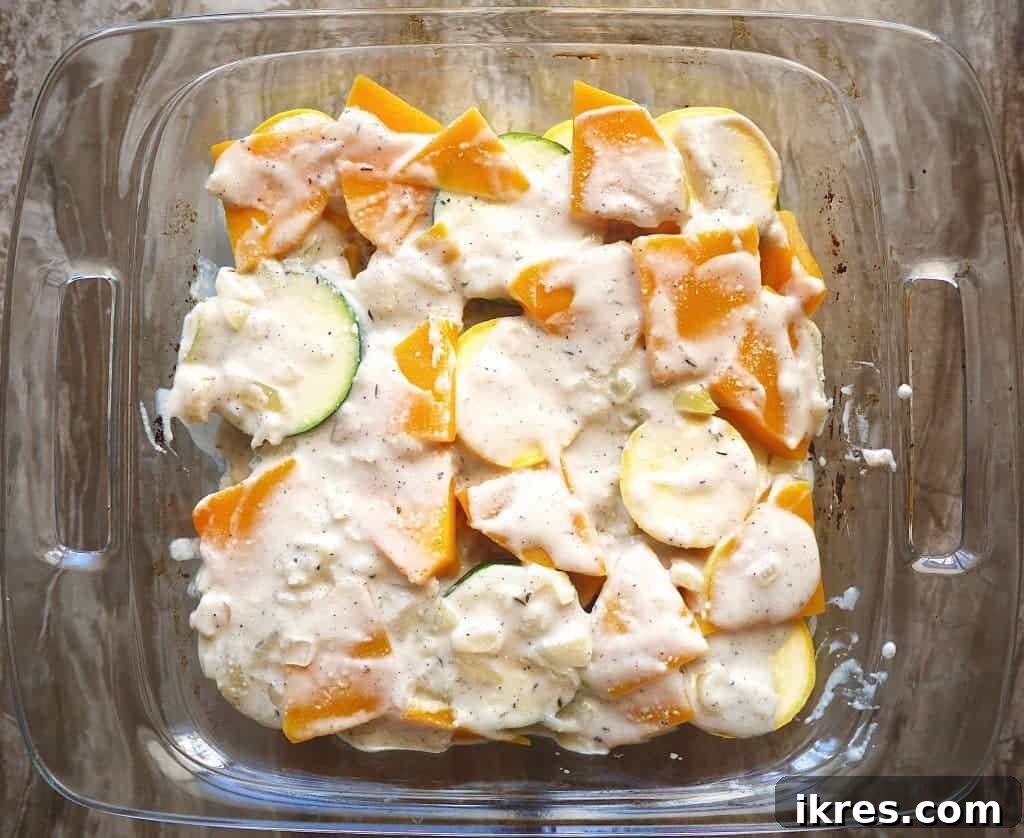 Paleo Gluten Free Squash Au Gratin 7 Sauce spread over squash layers