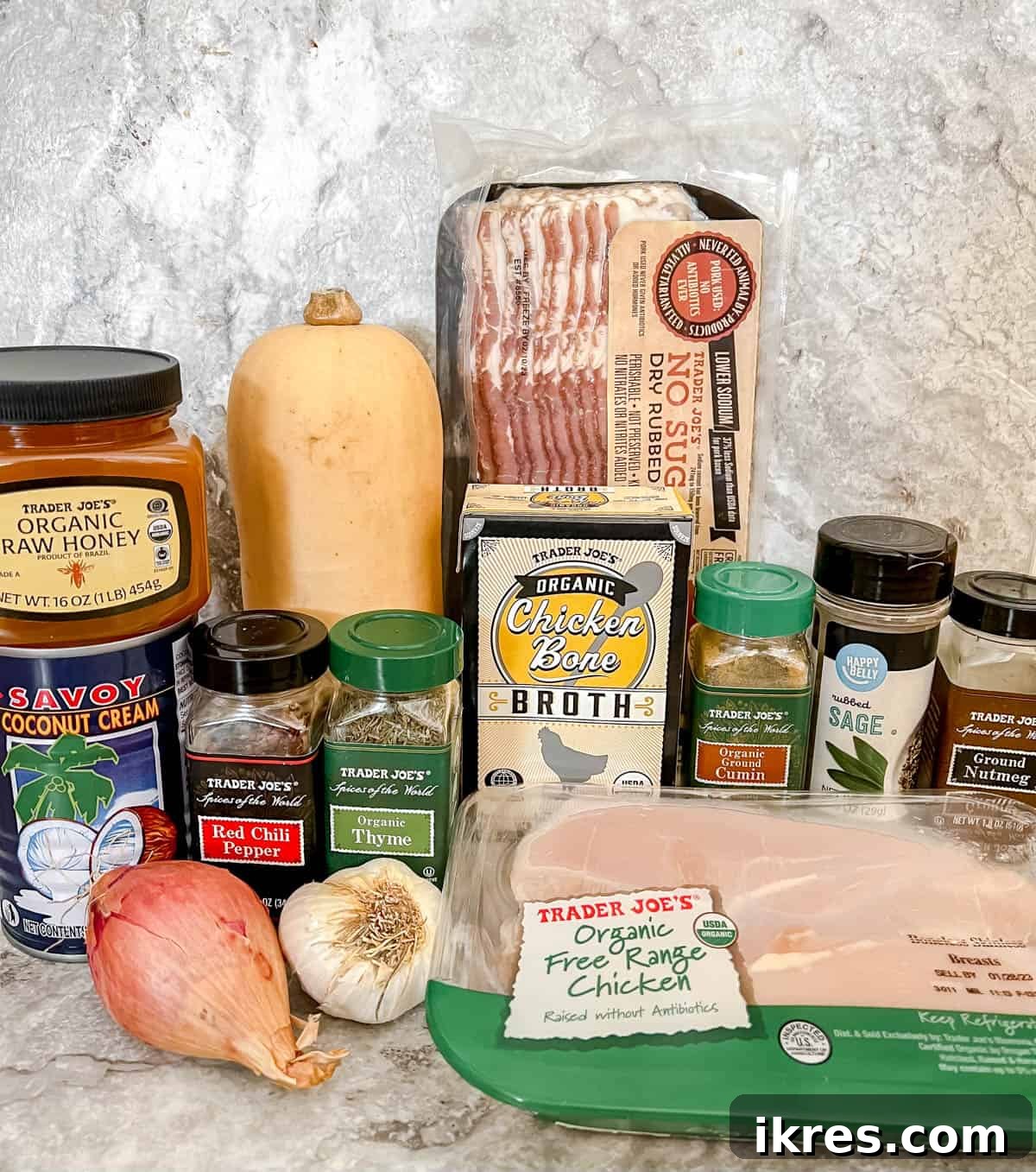 Ingredients for butternut squash and chicken soup laid out on a table.