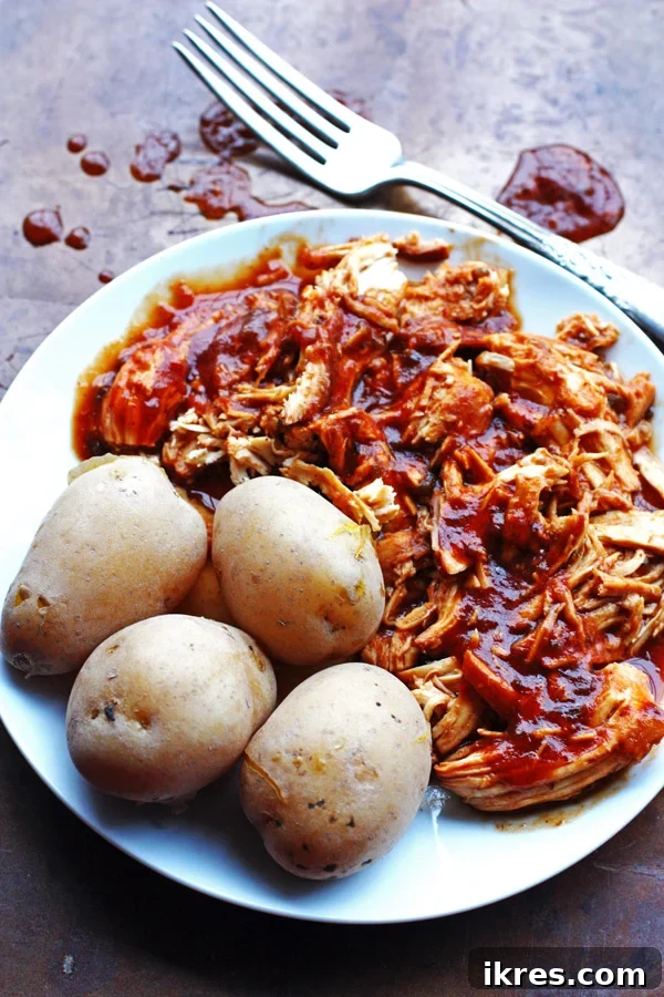 Delicious Crockpot Barbecue Chicken served with roasted potatoes and green beans