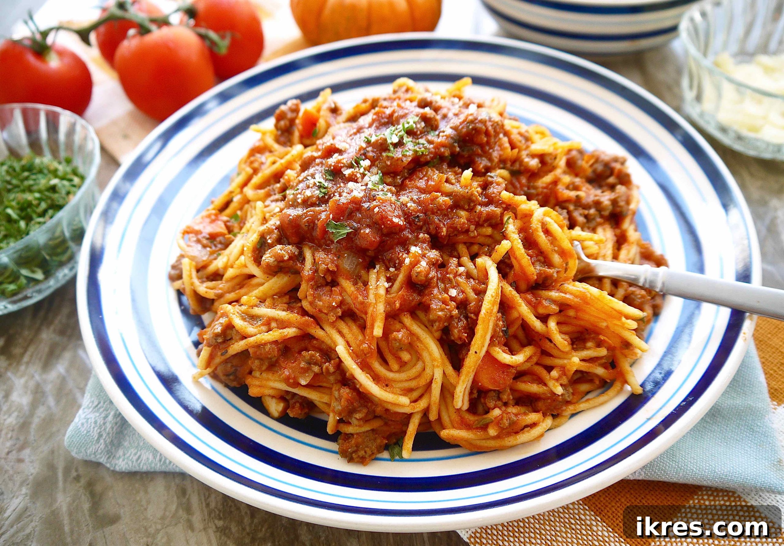Velvety Pumpkin Ragù 3 A large serving plate filled with pumpkin meat sauce, a fork resting in the rich, savory dish, highlighting its hearty texture.