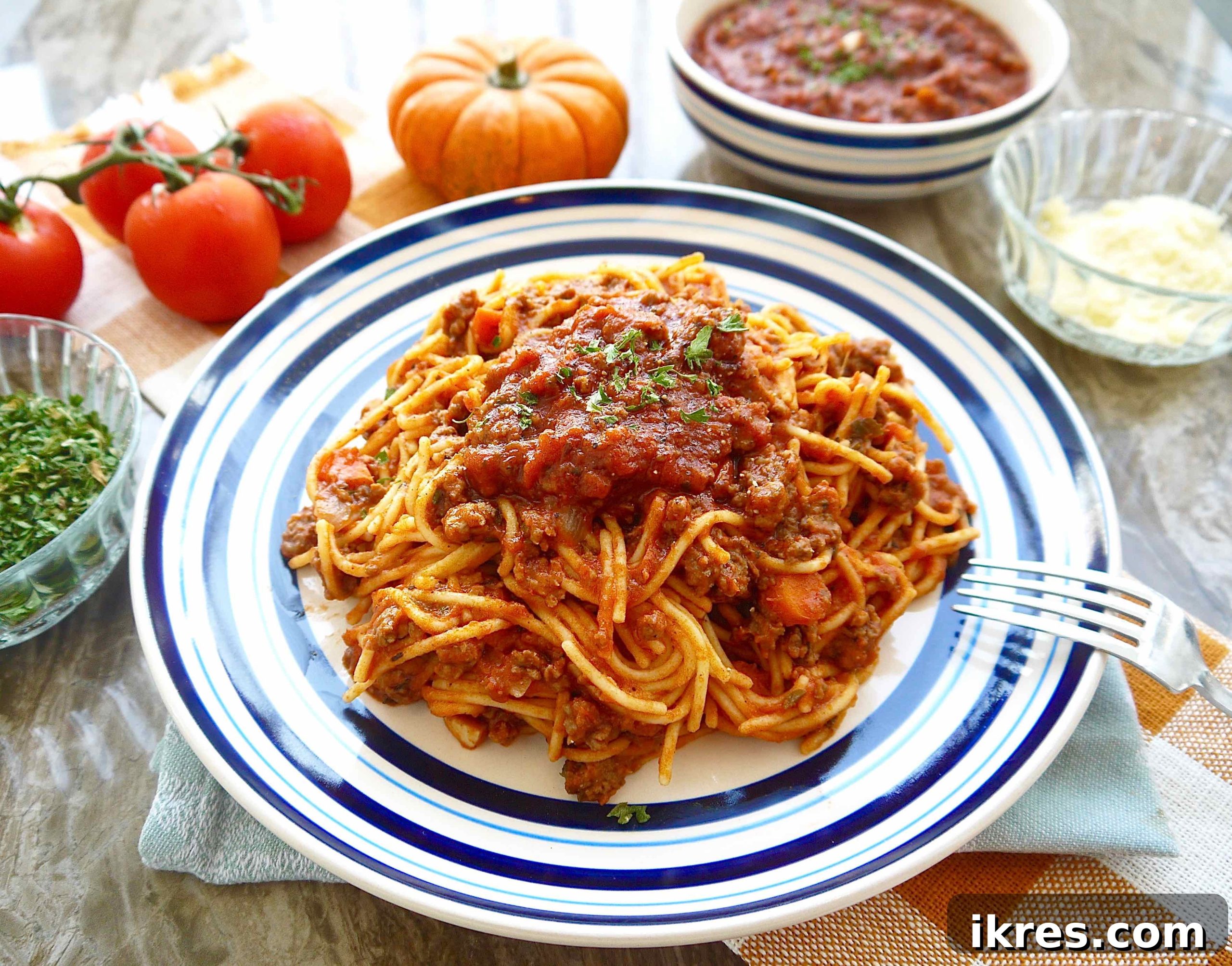 Velvety Pumpkin Ragù 6 A bowl of rich pumpkin tomato sauce with ground beef, served warm, promising a comforting and flavorful meal.