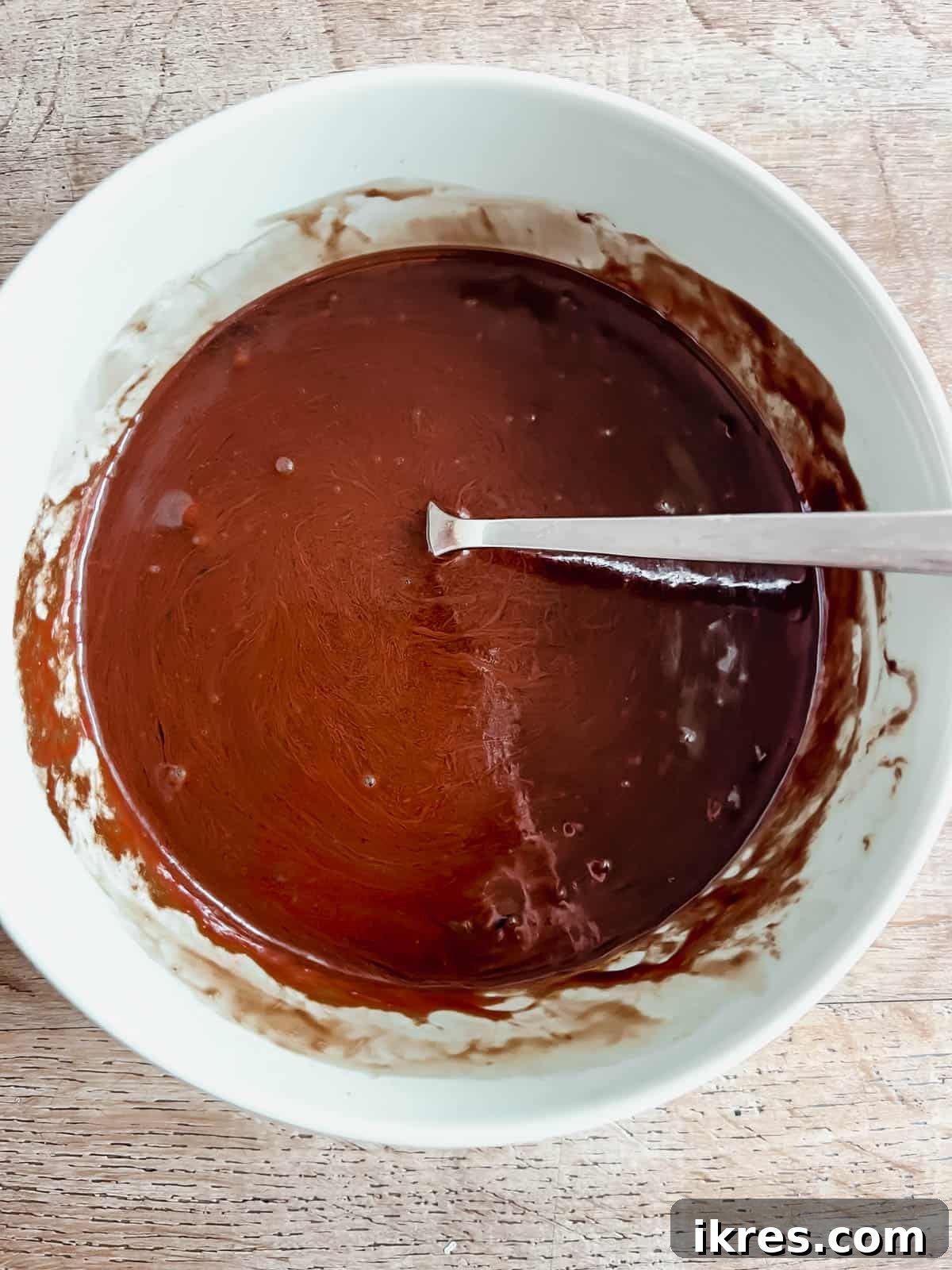 Small Batch Fudgy Almond Flour Brownies (Grain-Free) 4 Melted chocolate chips and olive oil in a mixing bowl.