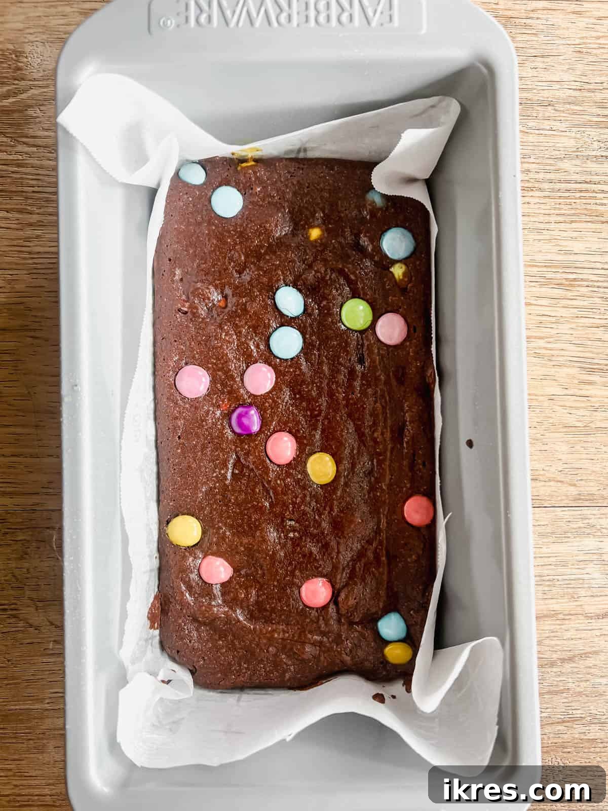 Small Batch Fudgy Almond Flour Brownies (Grain-Free) 7 Freshly baked almond flour brownies in the pan, showing slightly set edges and a softer center.