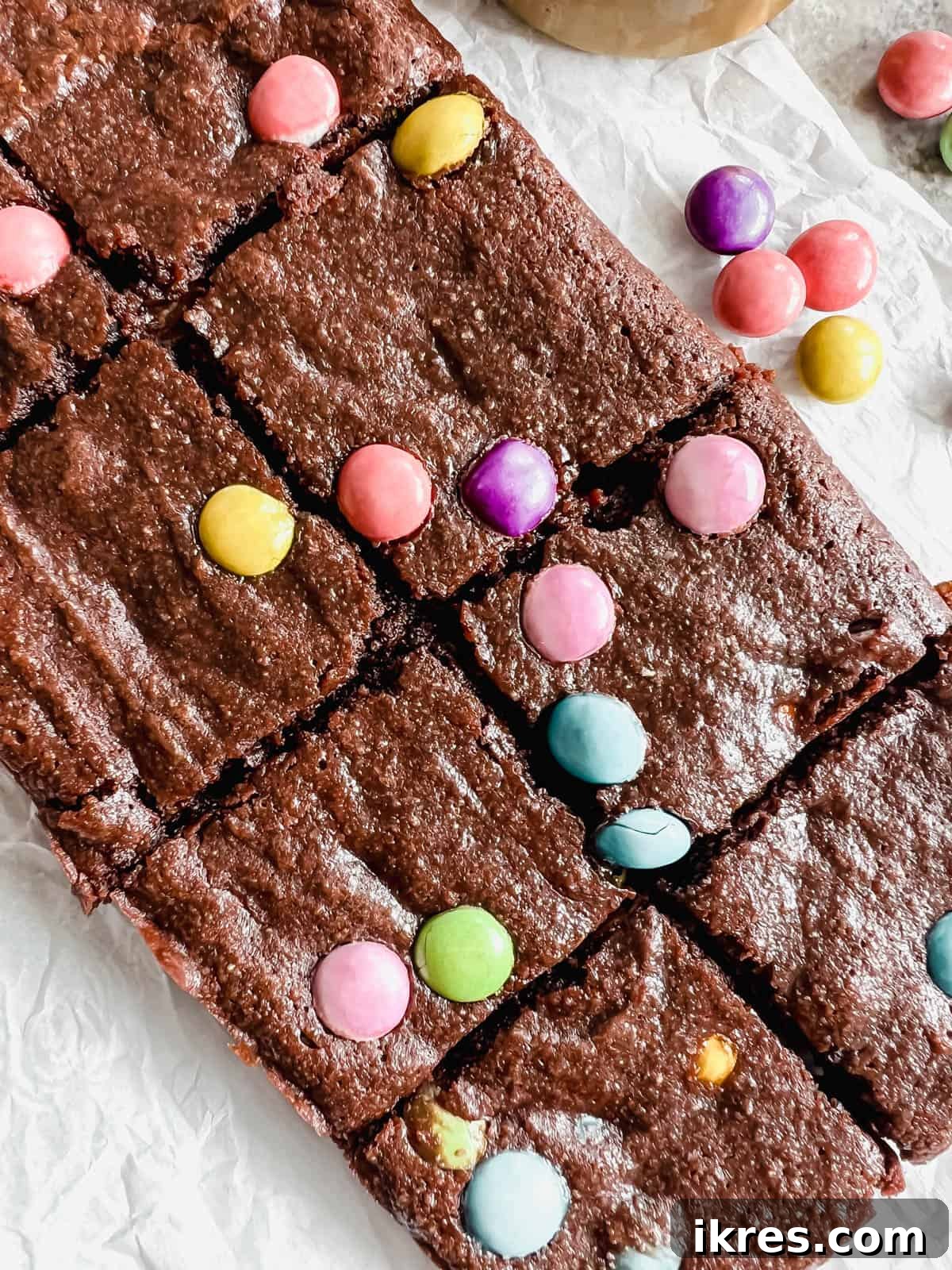 Small Batch Fudgy Almond Flour Brownies (Grain-Free) 8 Fudgy almond flour brownies sliced into uniform pieces on a cutting board.
