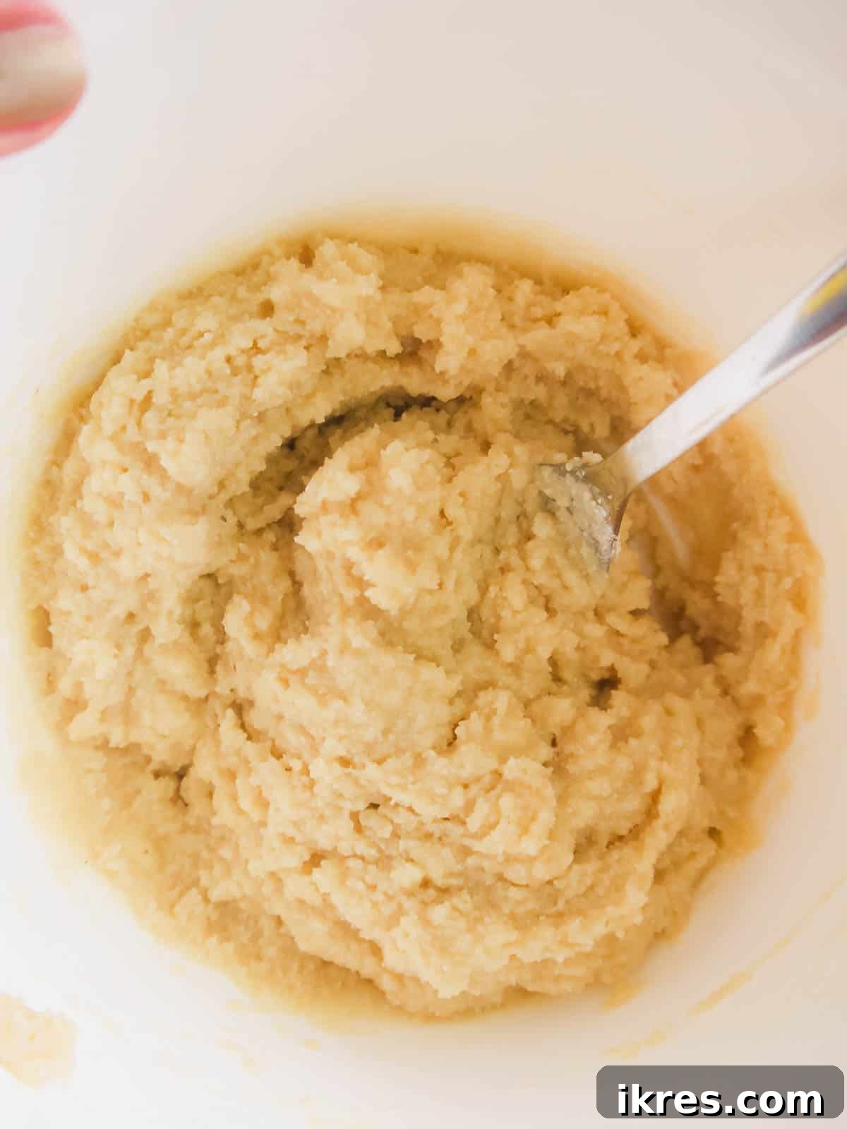Paleo Vanilla Bean Cookies 4 Paleo Sugar Cookies dough being mixed in a bowl, illustrating the initial steps of the recipe.