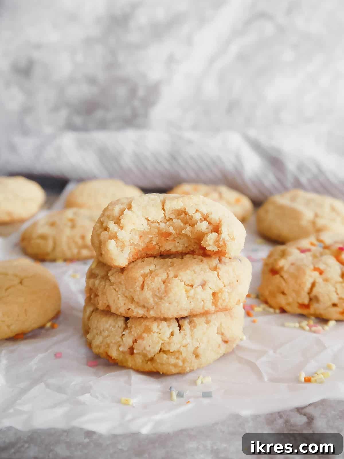 Paleo Vanilla Bean Cookies 7 Three perfectly stacked paleo sugar cookies, showcasing their soft texture and appealing presentation.