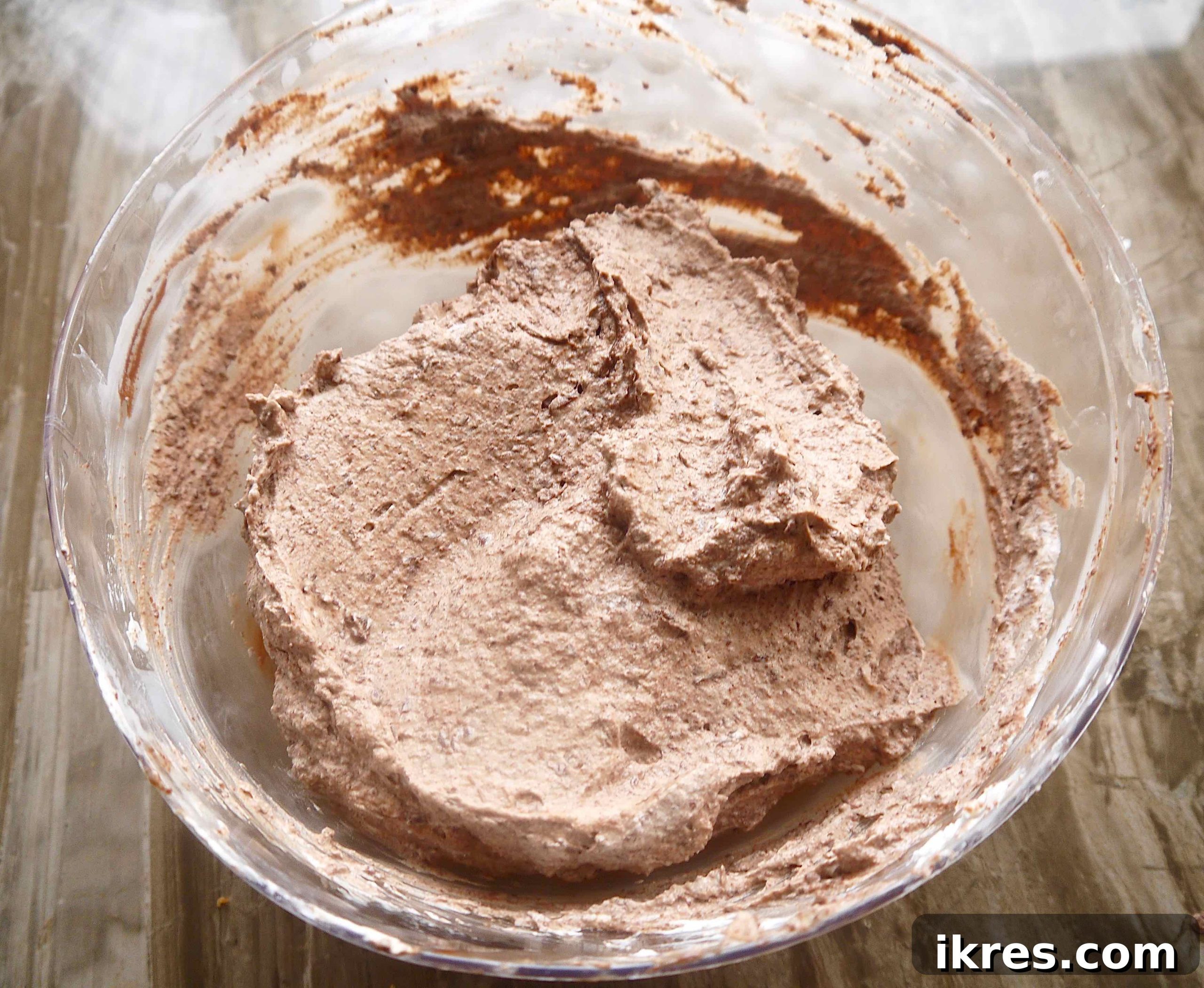 Melted chocolate and whipped coconut cream delicately mixed together to form the Paleo chocolate mousse.