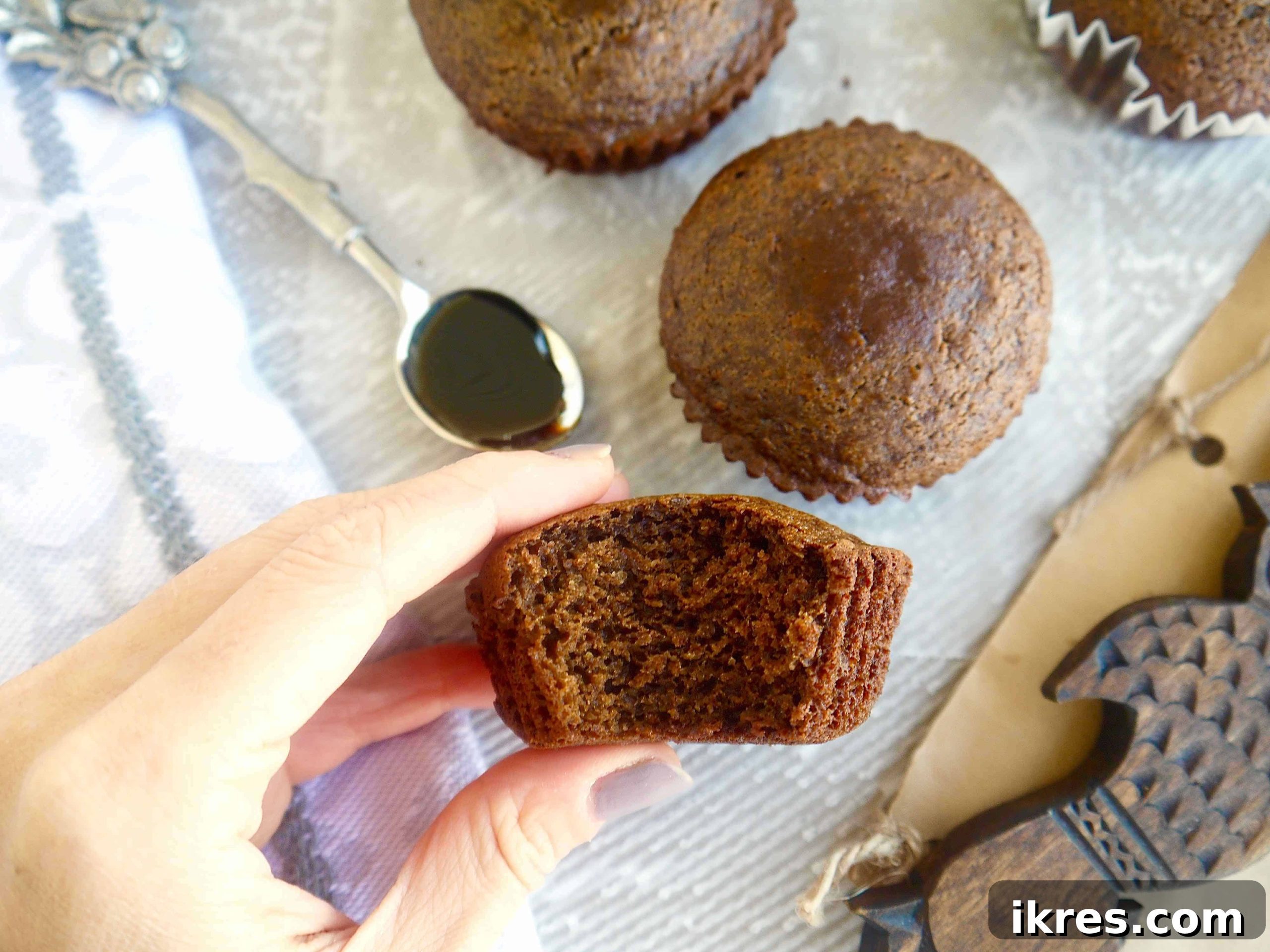 Deliciously moist chestnut flour gingerbread muffins on a cooling rack, highlighting their perfect golden-brown tops and inviting texture. Ideal for gluten-free and paleo diets.