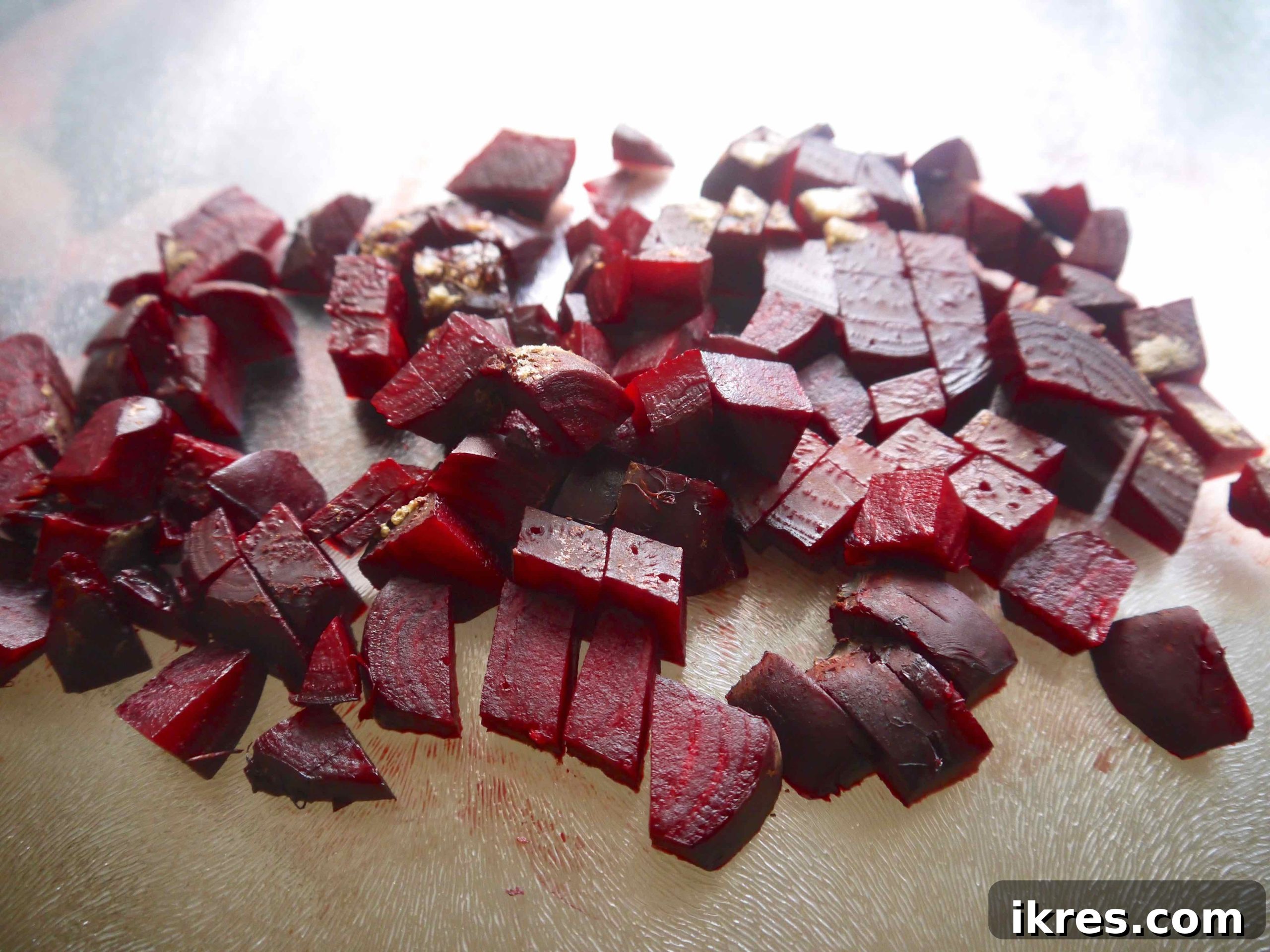 Vibrant Quinoa Beet Salad with Tuna 5 Finely diced boiled beets on a cutting board.