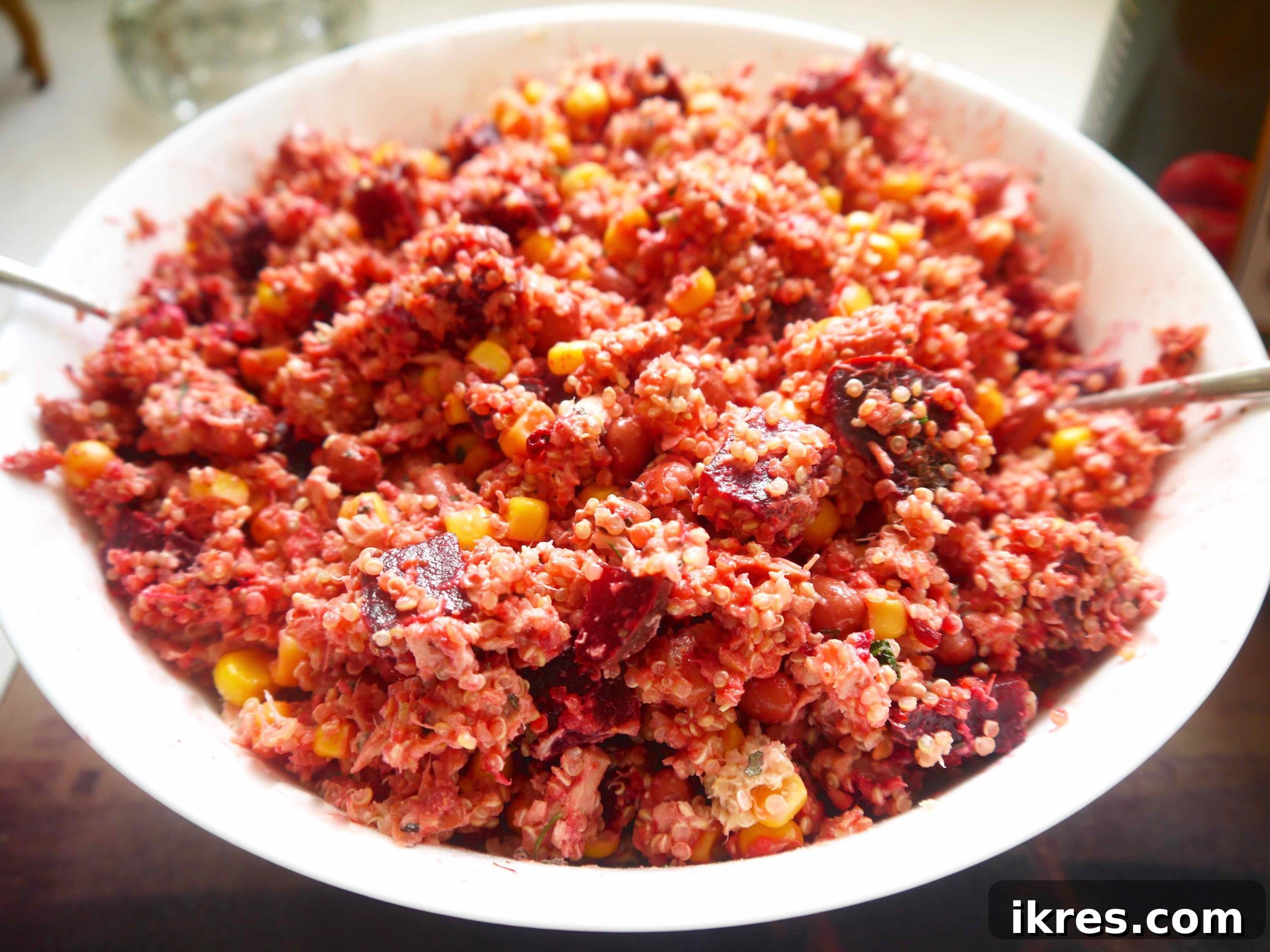 Vibrant Quinoa Beet Salad with Tuna 7 All the salad ingredients, including quinoa, corn, beans, and beets, combined in a large bowl with the tuna mixture.