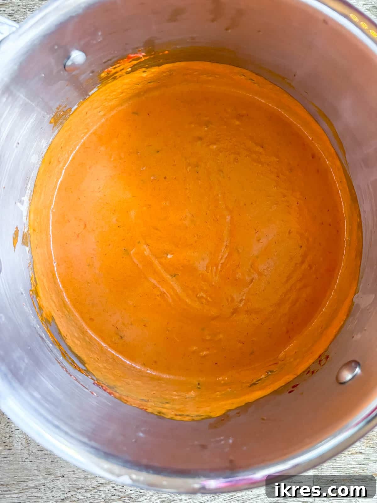 Vegan Vodka Rose Sauce 7 Thick coconut cream, reserved pasta water, dried basil, and a pinch of salt carefully added to the simmering vodka sauce, creating a creamy base.