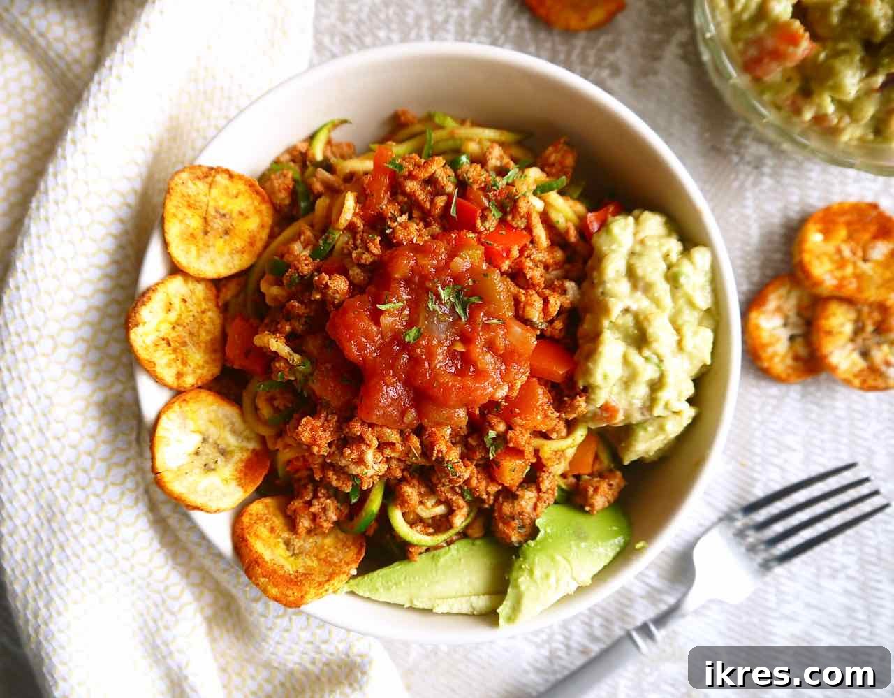 Zesty Turkey Taco Zoodle Bowls 8 A close-up of zucchini noodles perfectly seasoned and mixed with the delicious ground turkey taco meat, ready to be enjoyed.