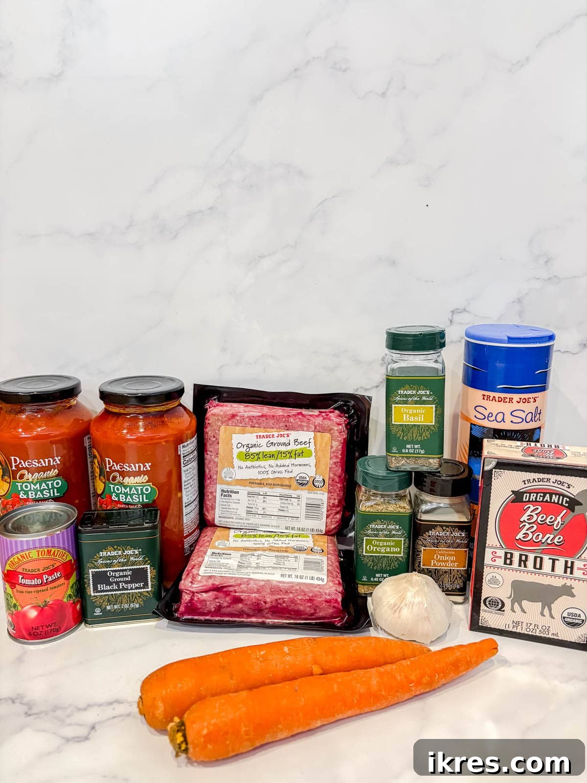 Fresh ingredients laid out for making slow cooker spaghetti sauce with ground beef.