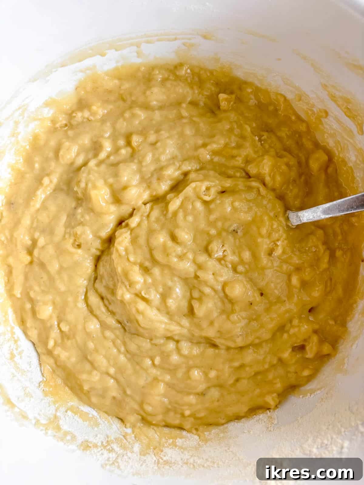 Strawberry Swirl Banana Bread 6 The wet and dry ingredients for strawberry banana bread mixed together to form a smooth batter.