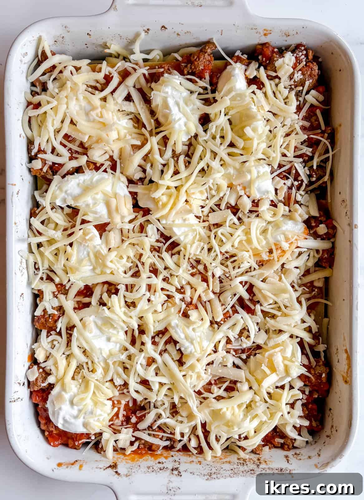 Effortless Greek Yogurt Lasagna 11 Repeating the layers of meat sauce, Greek yogurt, and shredded cheeses.