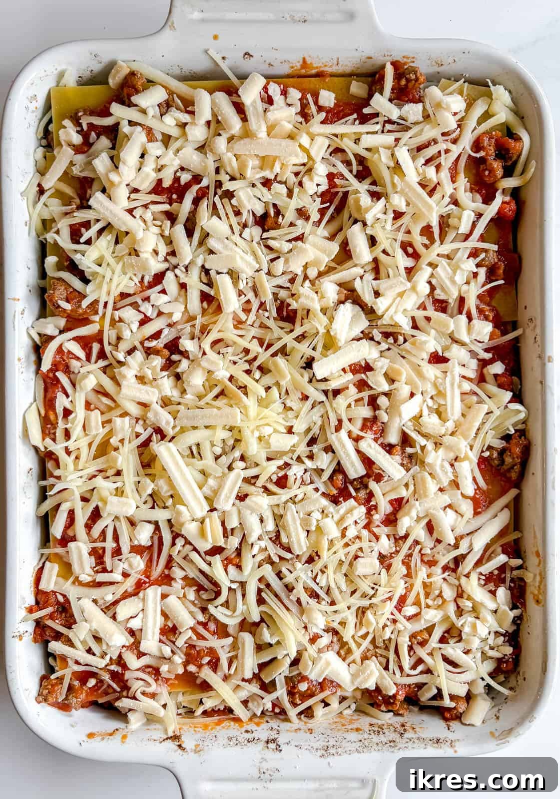 Effortless Greek Yogurt Lasagna 13 The assembled lasagna topped with the remaining meat sauce and cheeses, ready for the oven.