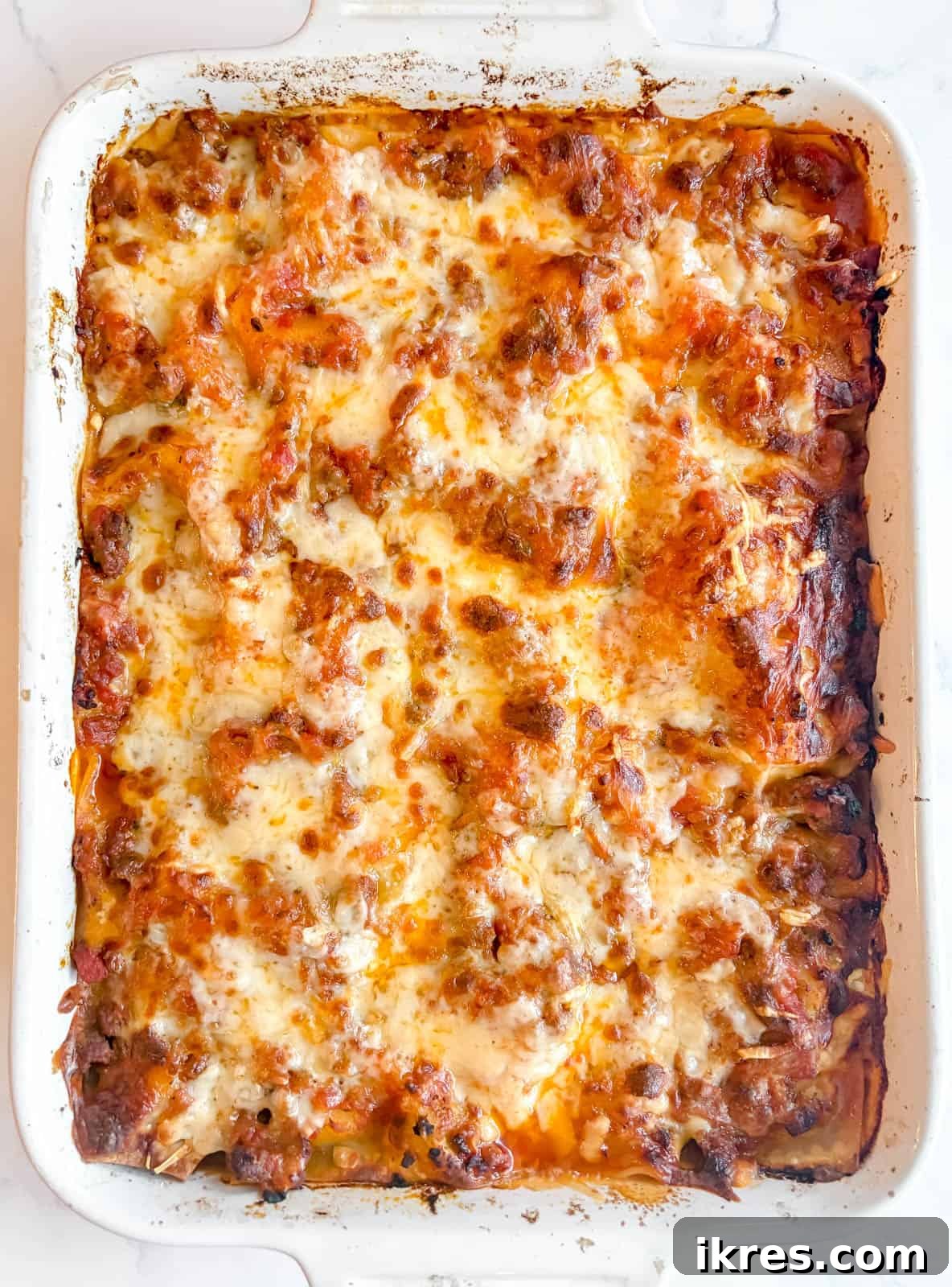 Effortless Greek Yogurt Lasagna 14 The fully baked no-boil lasagna fresh out of the oven, with a bubbly, golden-brown cheese crust.