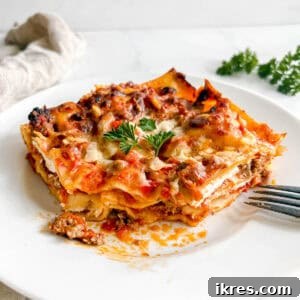 Effortless Greek Yogurt Lasagna 16 A slice of easy no-boil lasagna on a plate.