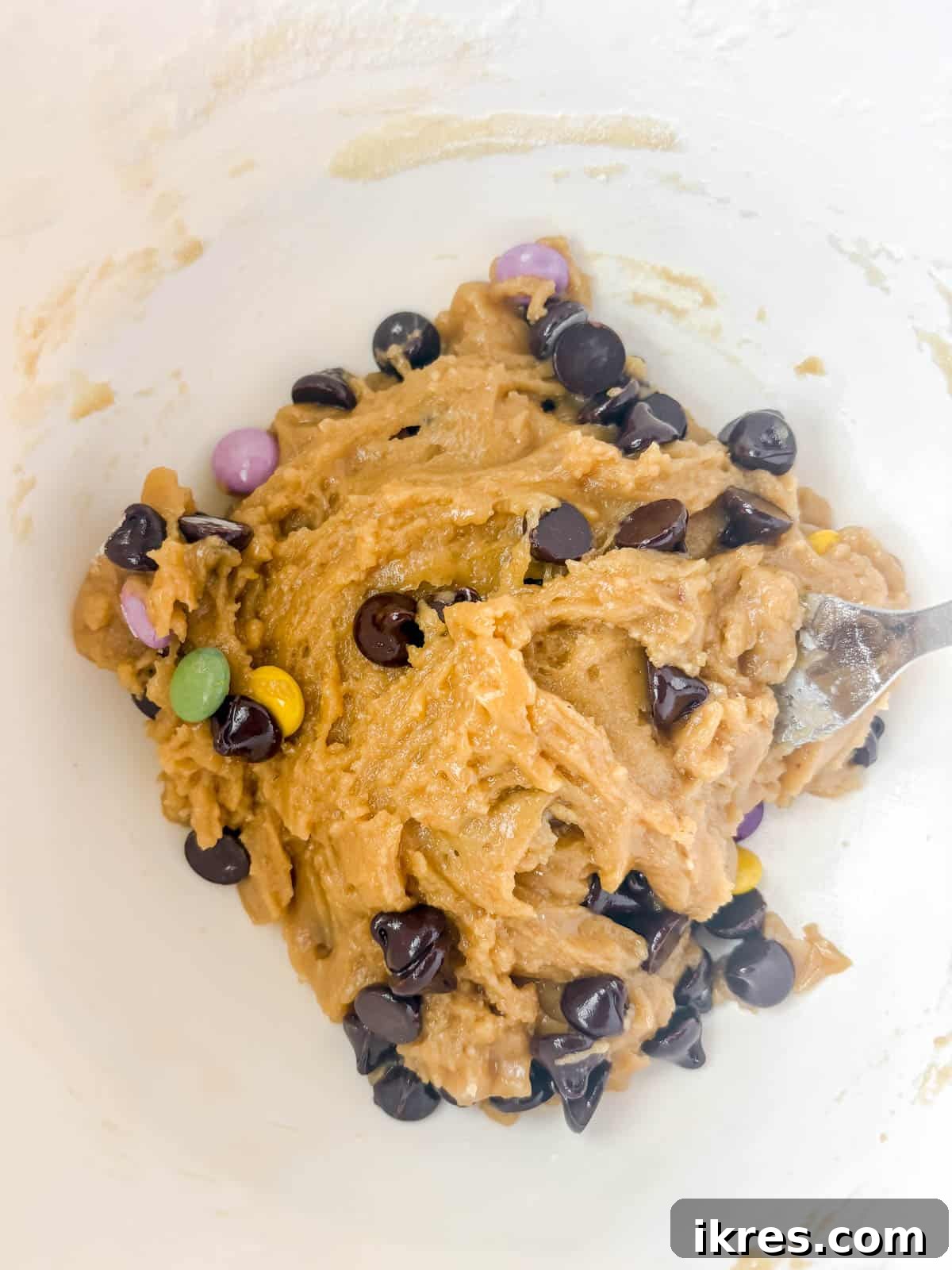 Small Batch Chocolate Chip Cookie Recipe (Makes 12) 7 Chocolate chips added to the cookie dough in the bowl.