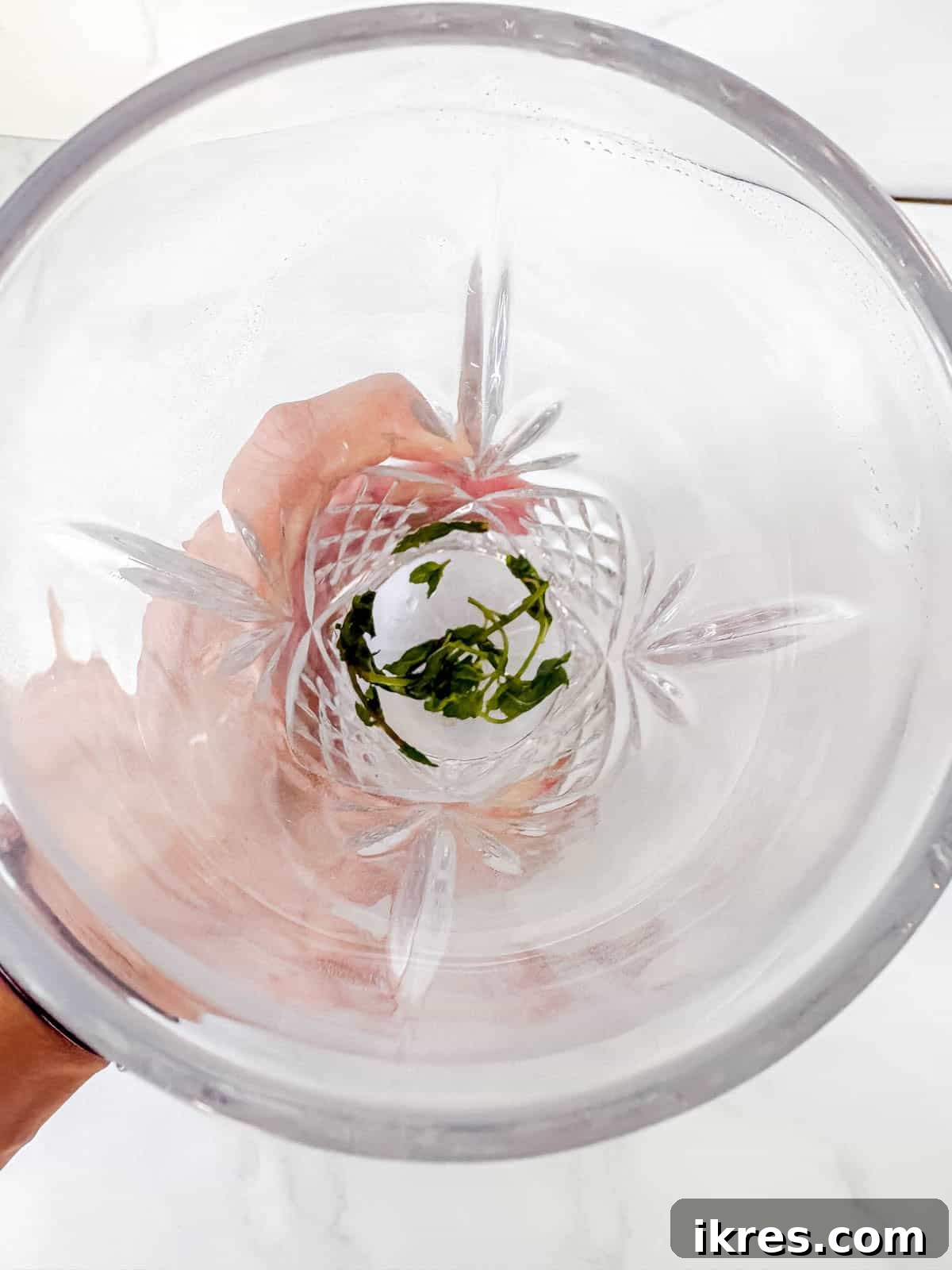 Pear Vodka Moscow Mule: Refreshing Pear Cocktail 4 Muddling the mint leaves in a drink shaker.