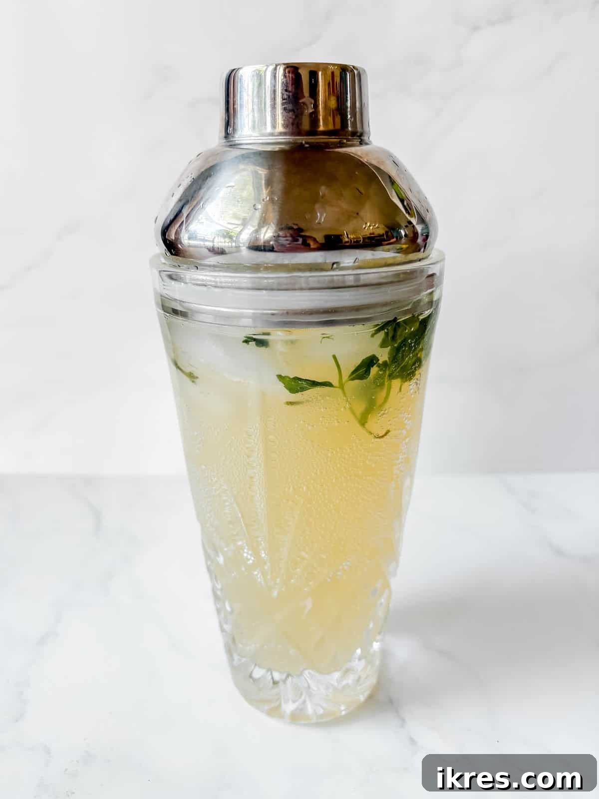 Pear Vodka Moscow Mule: Refreshing Pear Cocktail 5 Pear liqueur cocktail mixture in the cocktail shaker.