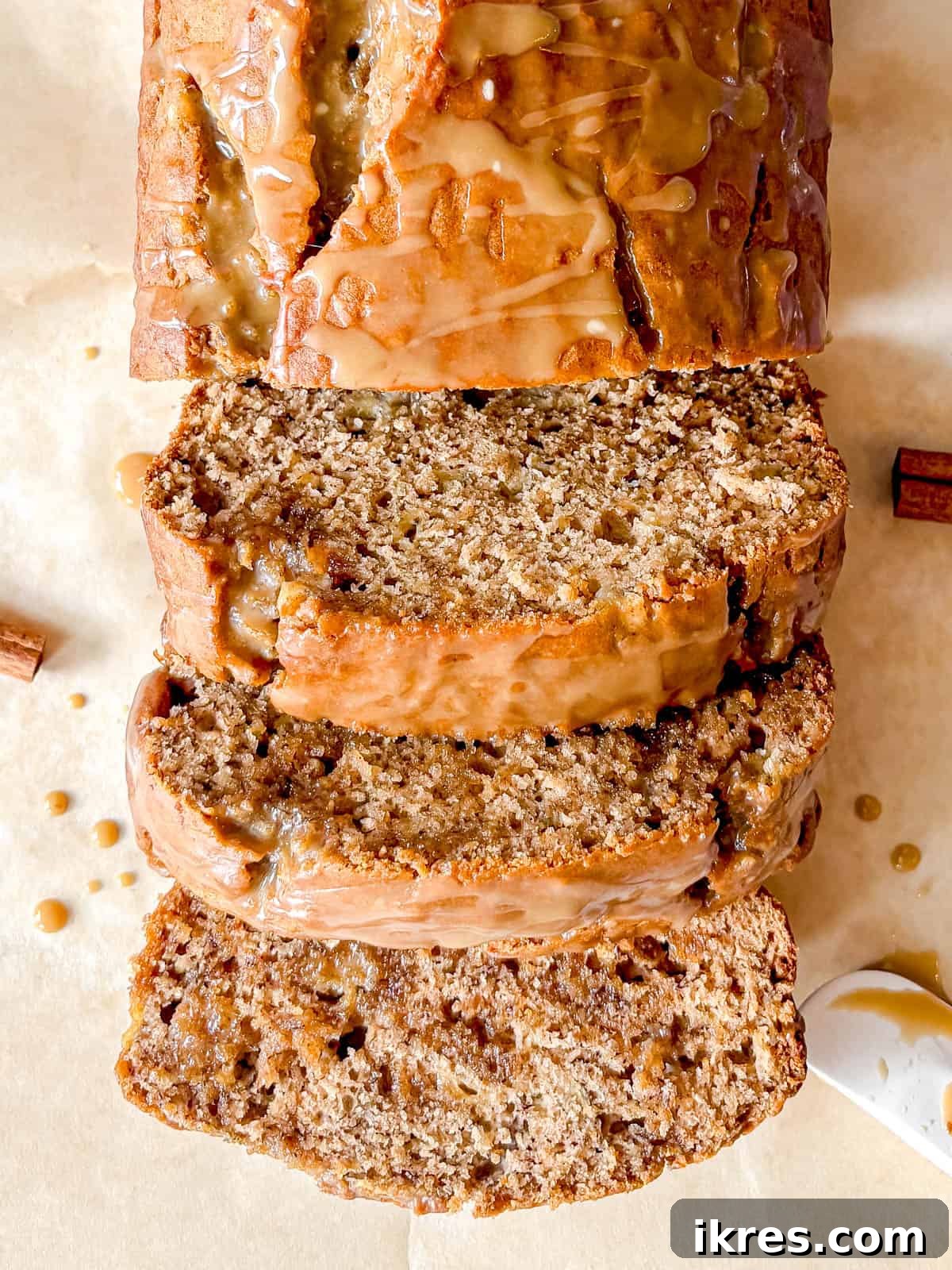 Slices of moist maple banana bread with maple glaze.