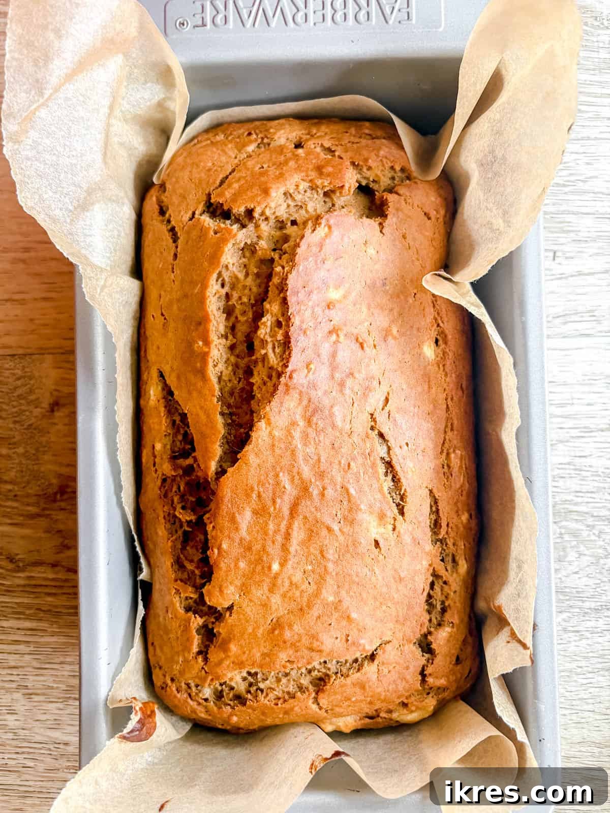 Maple banana bread in a pan after baking.