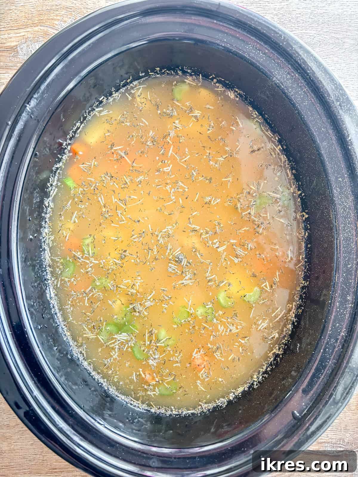 Chicken potato soup in crockpot before cooking.